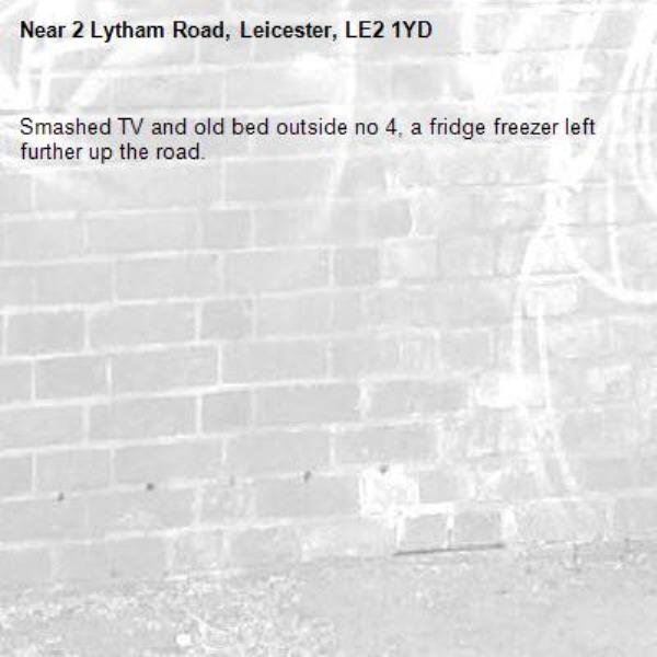 Smashed TV and old bed outside no 4, a fridge freezer left further up the road.-2 Lytham Road, Leicester, LE2 1YD