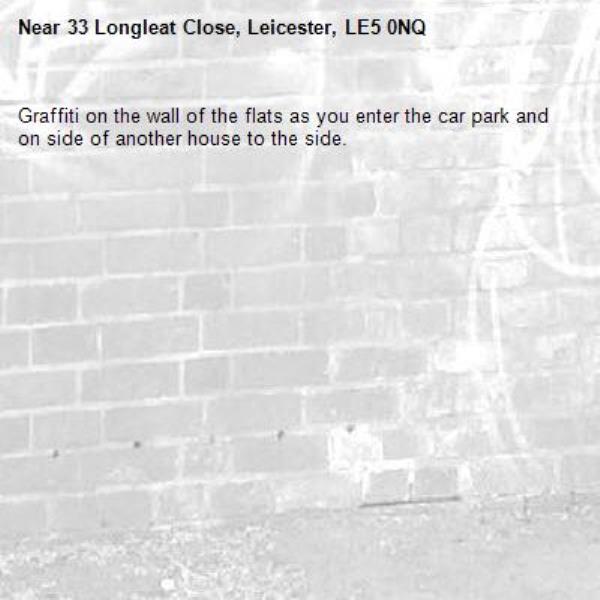 Graffiti on the wall of the flats as you enter the car park and on side of another house to the side. -33 Longleat Close, Leicester, LE5 0NQ