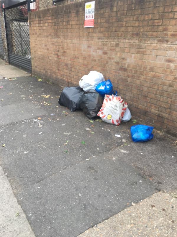 Dumped rubbish on side wall 
Thanks -1 Milton Avenue, East Ham, London, E6 1BG