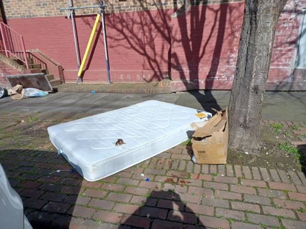 Mattress and cardboard box fly tipped underneath a tree outside 1 Lawson Road, E16. -1 Lawson Close, West Beckton, London, E16 3JS
