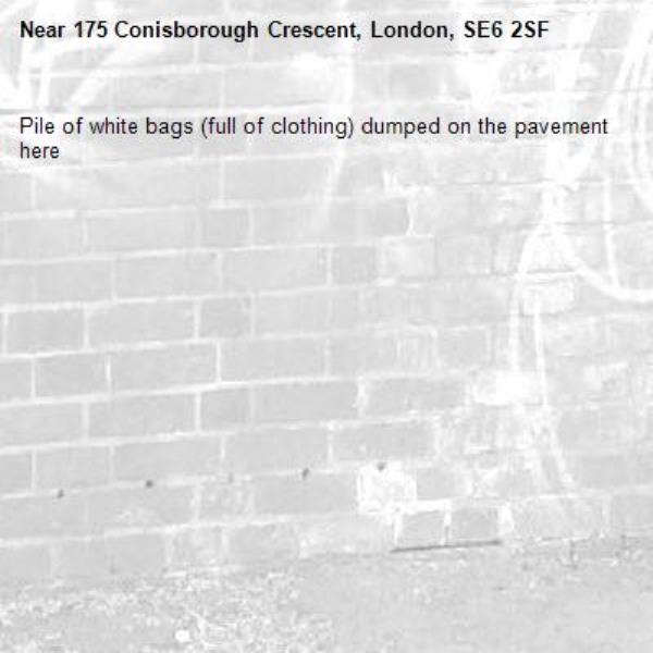 Pile of white bags (full of clothing) dumped on the pavement here-175 Conisborough Crescent, London, SE6 2SF