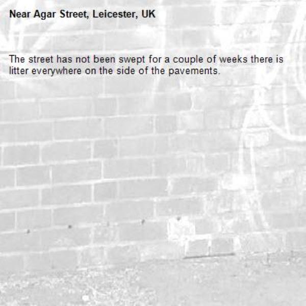 The street has not been swept for a couple of weeks there is litter everywhere on the side of the pavements.-Agar Street, Leicester, UK
