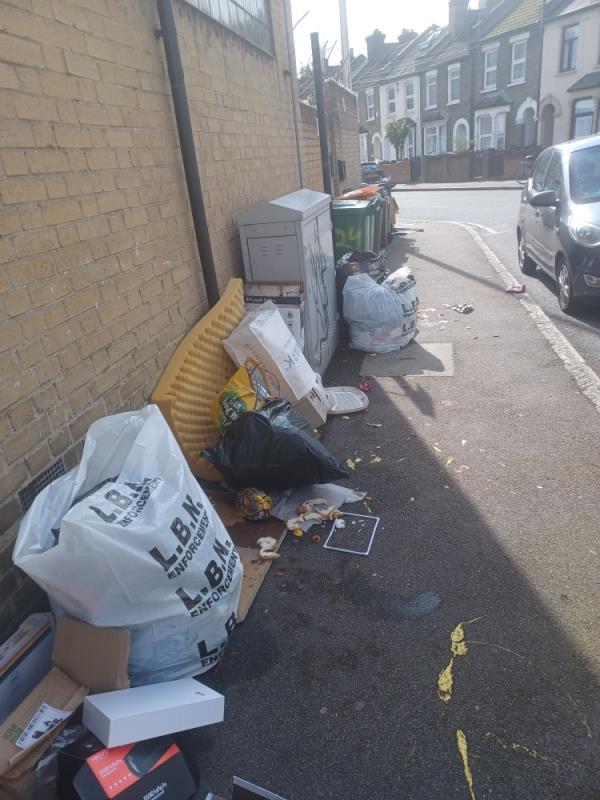 Cardboard boxes, cables and bags of household waste fly tipped at 20 Sussex Street, E13. -20 Sussex Street, Plaistow, London, E13 8QF