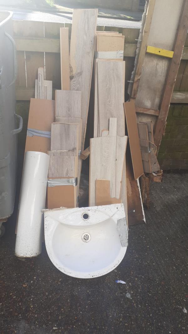 Fly Tip - Bathroom fixtures and fittings & flooring fly tipped at the front of the block - looks to be waste following bathroom refit-Poplar House, Wickham Road, London, SE4 1NE
