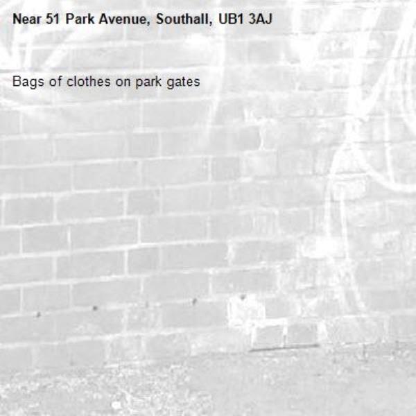 Bags of clothes on park gates-51 Park Avenue, Southall, UB1 3AJ