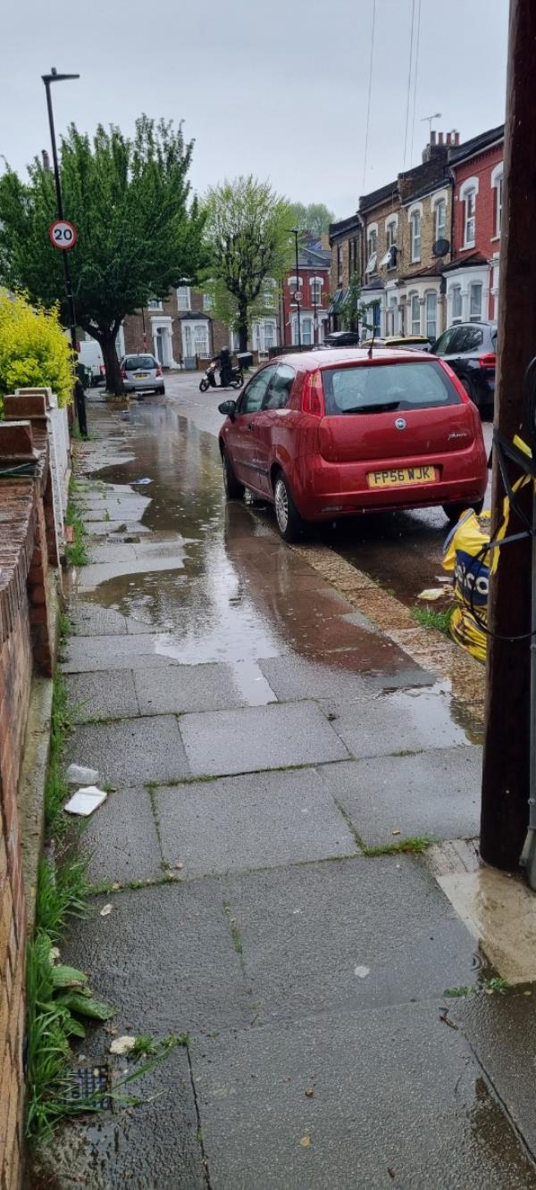 Gully is blocked by 2 large rubble bags causing flooding on pavement and road.-46 Elsden Road, Tottenham, London, N17 6RY
