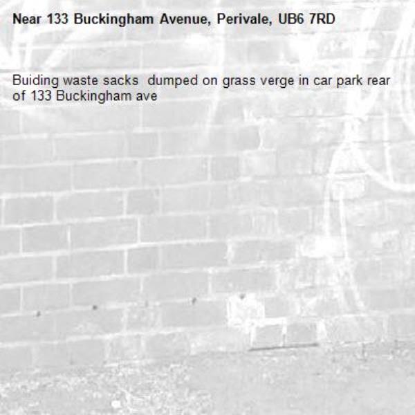 Buiding waste sacks  dumped on grass verge in car park rear of 133 Buckingham ave -133 Buckingham Avenue, Perivale, UB6 7RD