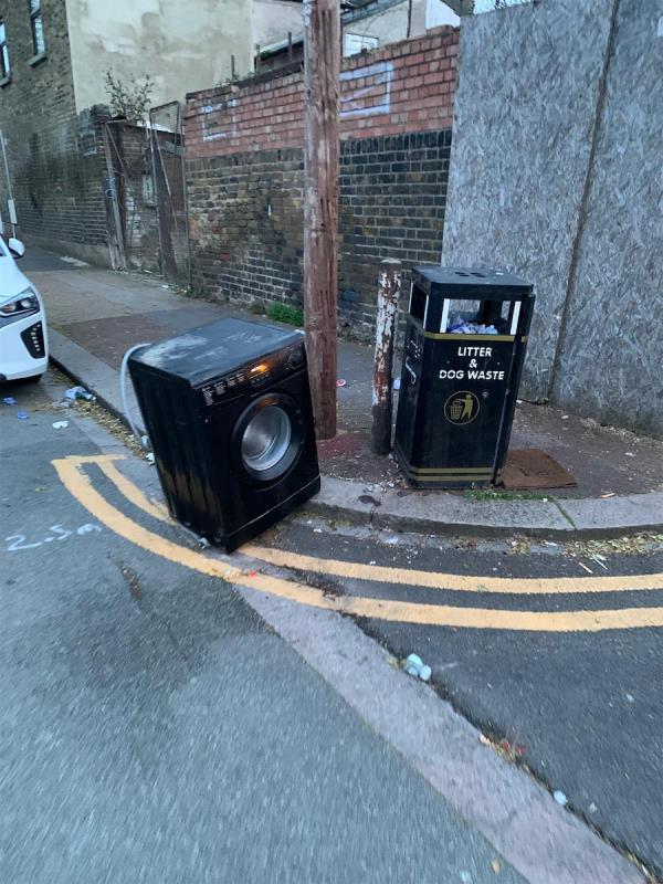 Washing machine left half on road-10 Isom Close, Plaistow, London, E13 8RR