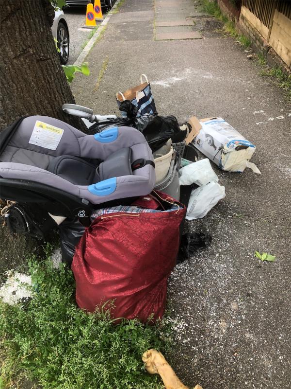 Opposite no 6. Please clear flytip of a babies chair and bags-6 Haddington Road, Bromley, BR1 5RH