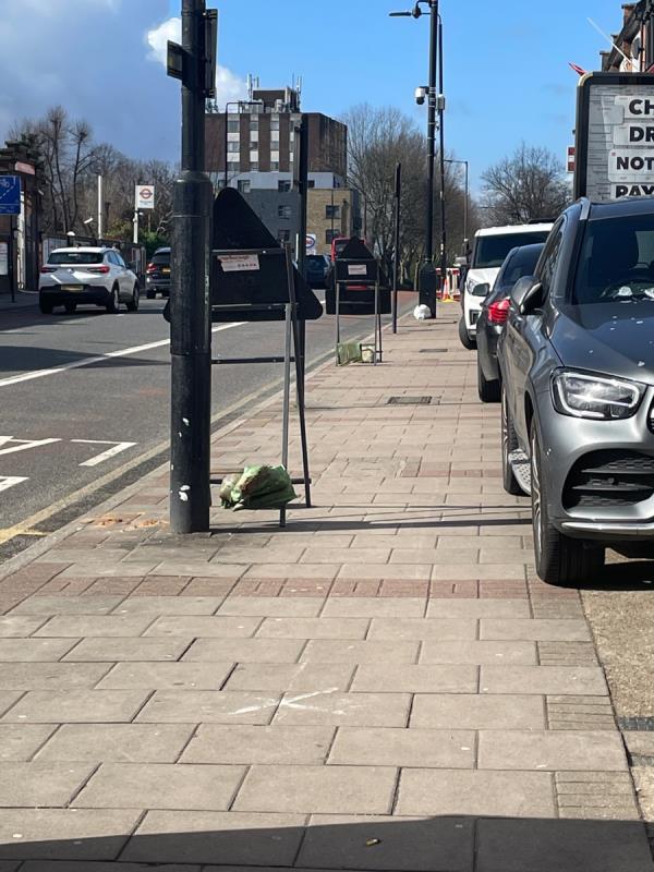 Cars with wheels encroaching on pavement + road signed + barriers. Just where are pedestrians supposed to go? -631A, Romford Road, Manor Park, London, E12 5AD