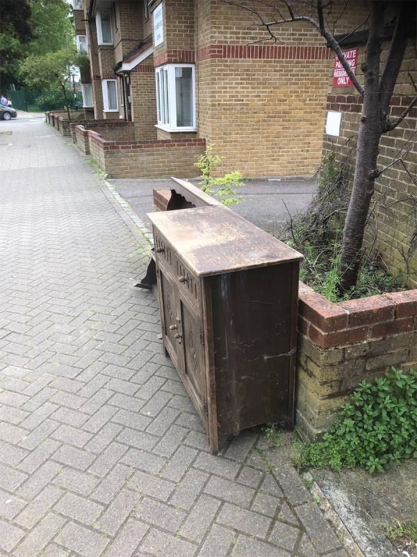 Please clear flytio of wooden unit from Whitefoot Lane side of block-9 Orchid Court, 167 Downderry Road, Bromley, BR1 5QE
