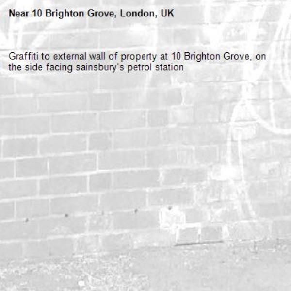 Graffiti to external wall of property at 10 Brighton Grove, on the side facing sainsbury's petrol station-10 Brighton Grove, London, UK