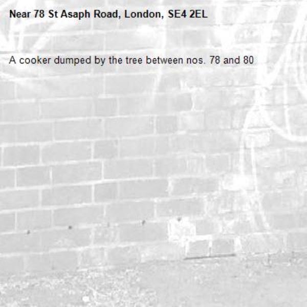 A cooker dumped by the tree between nos. 78 and 80-78 St Asaph Road, London, SE4 2EL