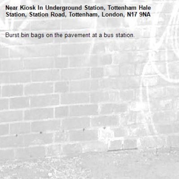 Burst bin bags on the pavement at a bus station.-Kiosk In Underground Station, Tottenham Hale Station, Station Road, Tottenham, London, N17 9NA