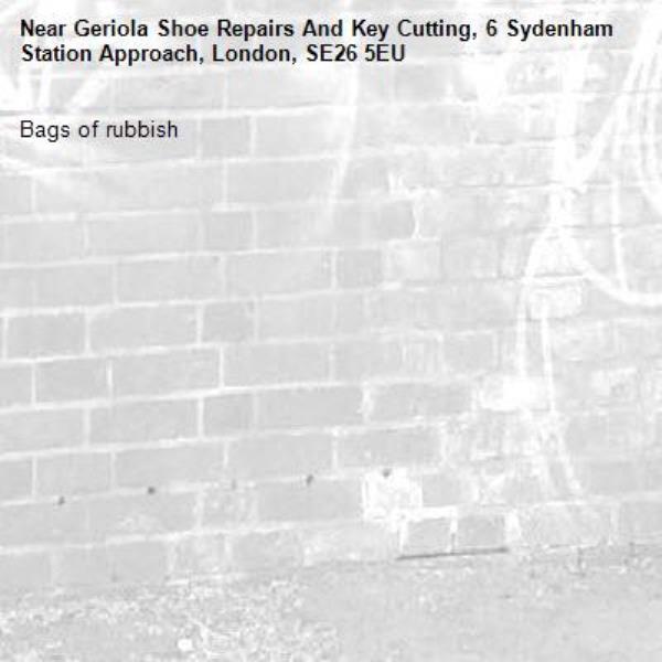 Bags of rubbish -Geriola Shoe Repairs And Key Cutting, 6 Sydenham Station Approach, London, SE26 5EU