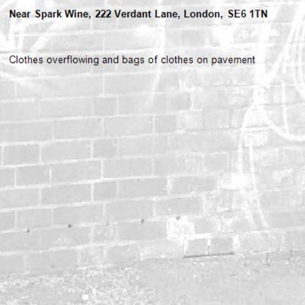 Clothes overflowing and bags of clothes on pavement-Spark Wine, 222 Verdant Lane, London, SE6 1TN
