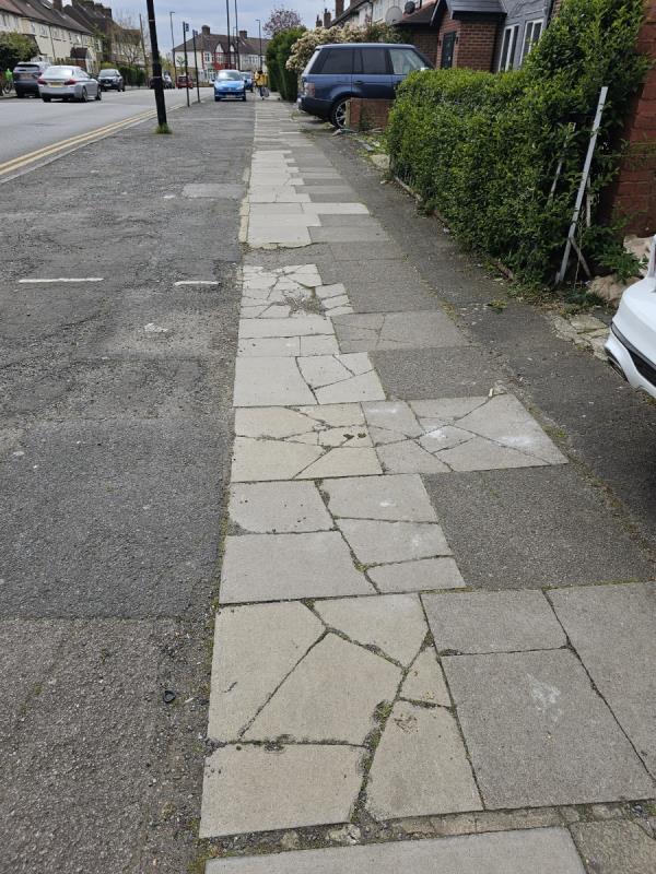 The paving slabs all along this stretch of Perth Road are smashed from people driving on them, including sections which aren't driveways. Please replace them all AND place some kind of concrete barrier strip along the edge of the parking areas to prevent this from happening again. -149 Perth Road, Wood Green, London, N22 5QH