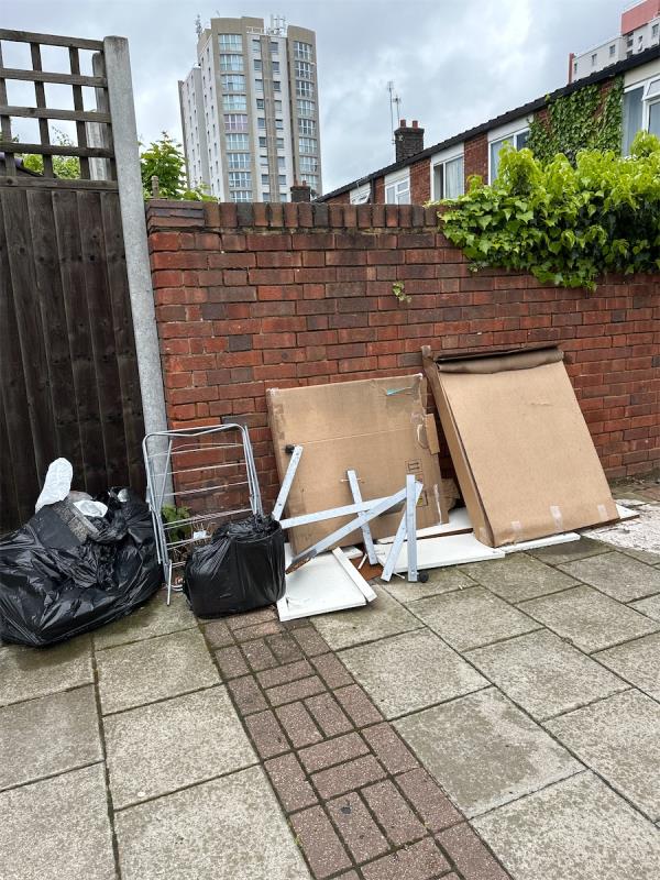 Discarded household items and rubbish opposite 30 chadd green -30 Brooks Road, Plaistow, London, E13 0NG