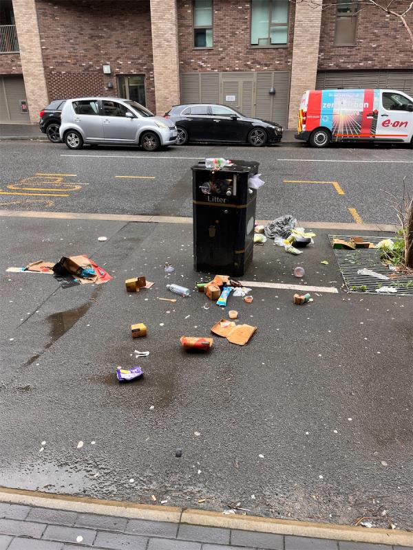 Overflowing bin near the bus stop.-39 Atlantis Avenue, Beckton, London, E16 2UD