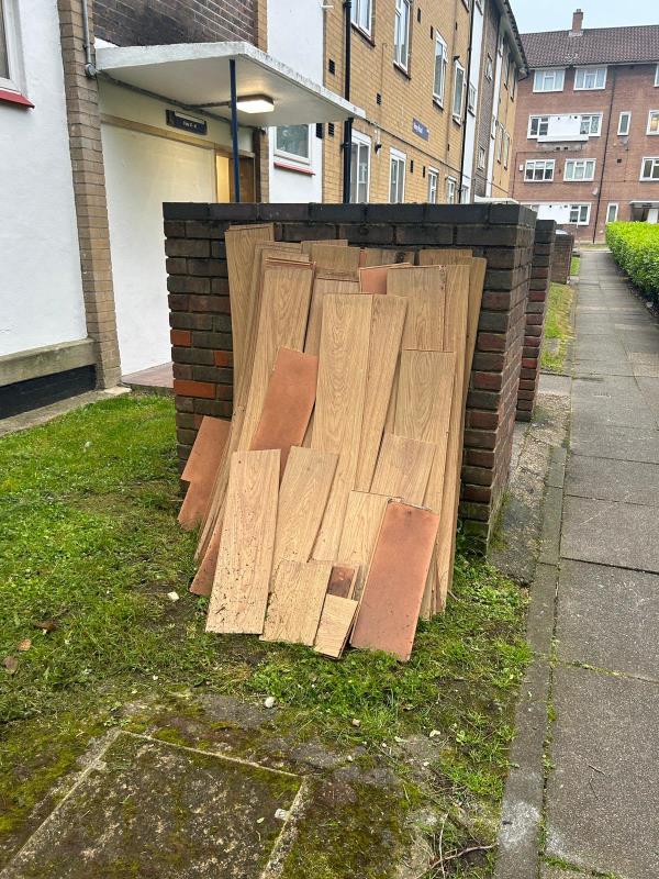 Laminate flooring fly tipped next to bin store at Viney road (block 37-47) - as this is a fly tip it will need to be collected by LBL team please-37 Viney Road SE13 7AW