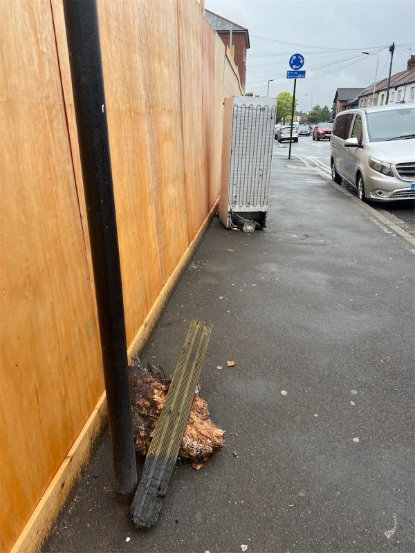 Large chunks of wood with nails in and a fridge on the side of the road -345 Burges Road, East Ham, London, E6 2ET