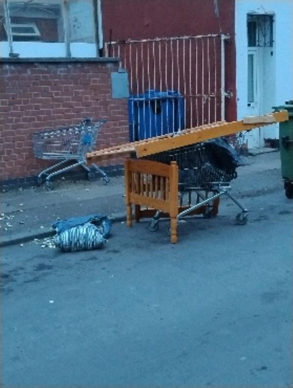 shopping trolleys, rubbish and furniture dumped near the corner of rowsley street and evington road.-Hare Govindam, 2 Rowsley Street, Leicester, LE2 1HL