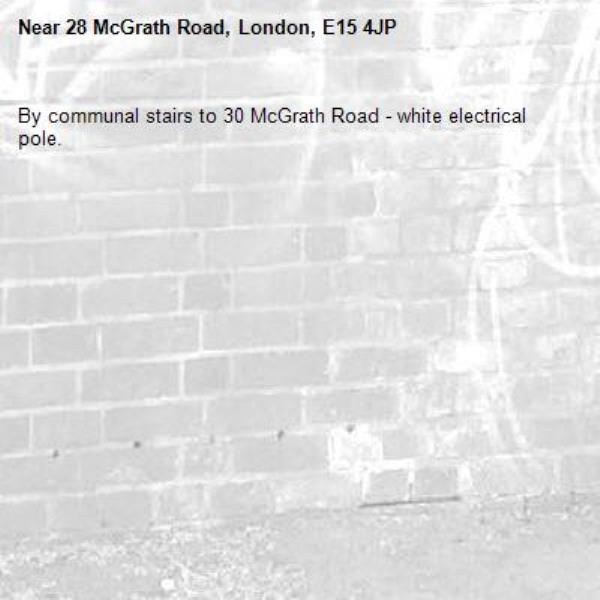 By communal stairs to 30 McGrath Road - white electrical pole.-28 McGrath Road, London, E15 4JP