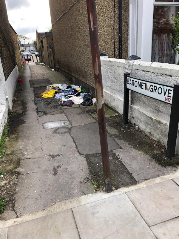 Rubbish and dumped clothes littering the length of the Baronet Grove alleyway. -13 Baronet Grove, Tottenham, London, N17 0LX