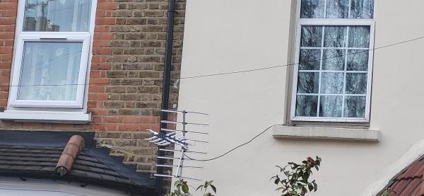 Not a street light but a telephone wire. Hanging very low and might detach or catch on a large vehicle -54 Elsenham Road, Manor Park, London, E12 6LA