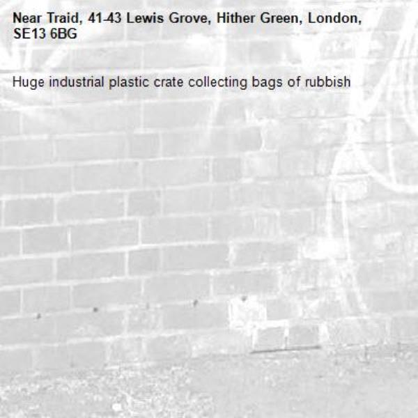 Huge industrial plastic crate collecting bags of rubbish-Traid, 41-43 Lewis Grove, Hither Green, London, SE13 6BG
