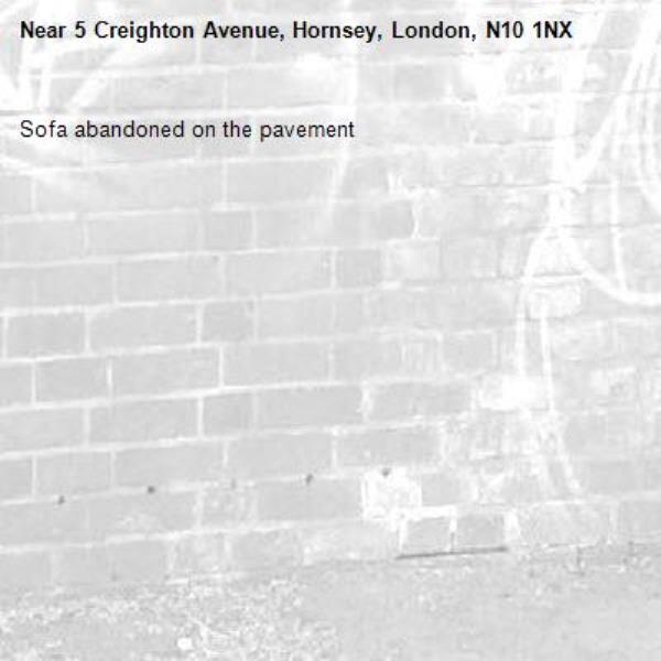 Sofa abandoned on the pavement -5 Creighton Avenue, Hornsey, London, N10 1NX