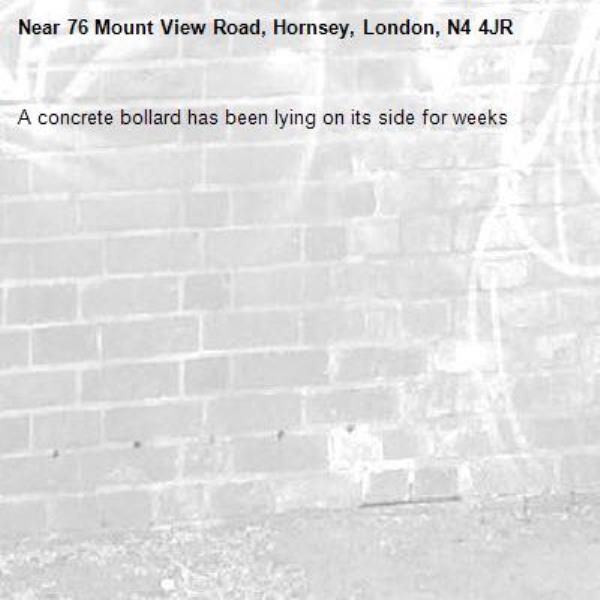 A concrete bollard has been lying on its side for weeks-76 Mount View Road, Hornsey, London, N4 4JR