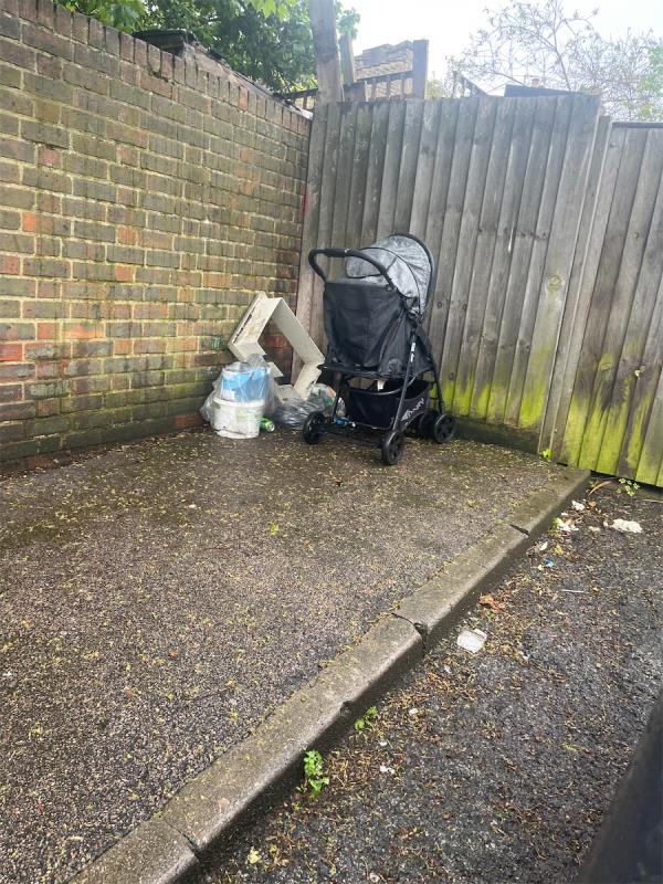 Dumped buggy and rubbish.-2 Brownlow Road, Forest Gate, London, E7 0EZ