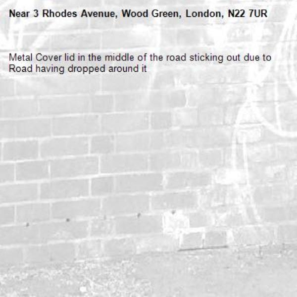 Metal Cover lid in the middle of the road sticking out due to Road having dropped around it-3 Rhodes Avenue, Wood Green, London, N22 7UR