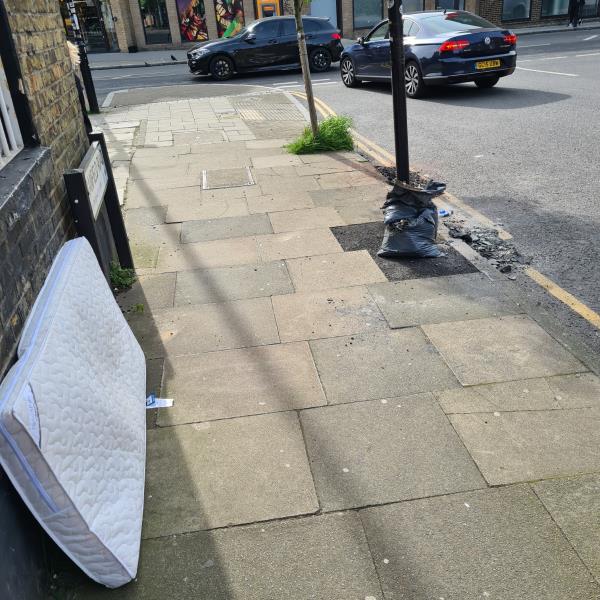 Bags of rubbish and rubbishin gutter ad matress -169--169A Brockley Road, Crofton Park, London, SE4 2RS