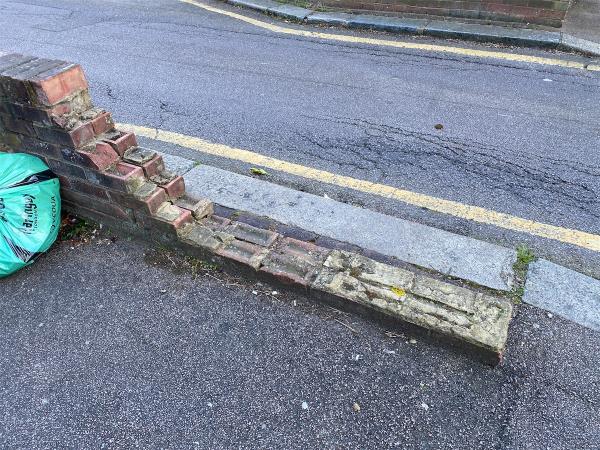 Broken brick wall, trip hazard, danger to children.-67 Duckett Road, Hornsey, London, N4 1BL
