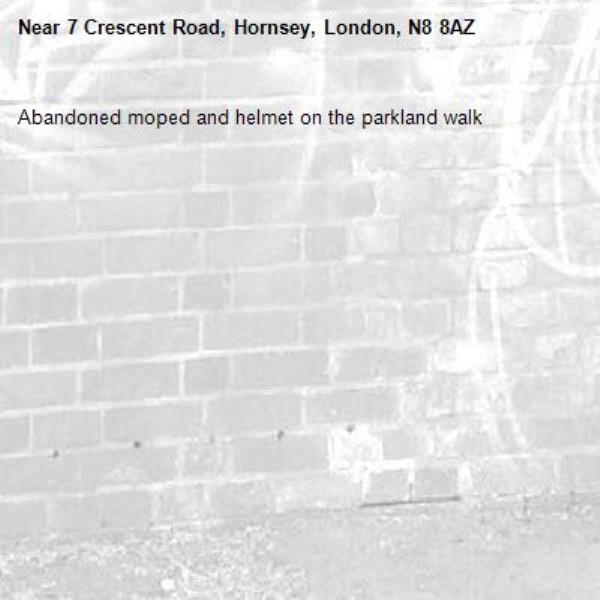 Abandoned moped and helmet on the parkland walk-7 Crescent Road, Hornsey, London, N8 8AZ