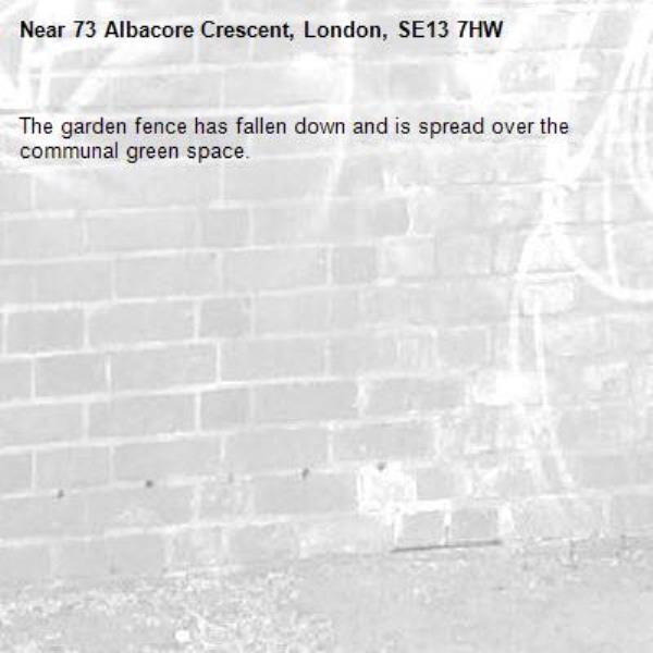 The garden fence has fallen down and is spread over the communal green space. -73 Albacore Crescent, London, SE13 7HW