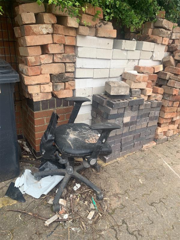Broken chair dumped in car park-92 Montague Road, Leicester, LE2 1TH