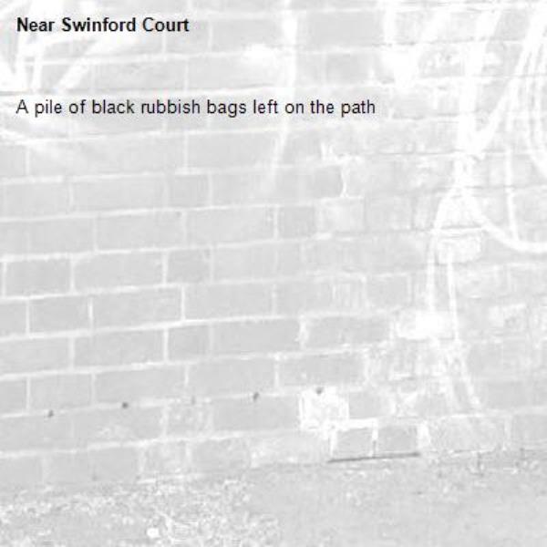 A pile of black rubbish bags left on the path -Swinford Court 