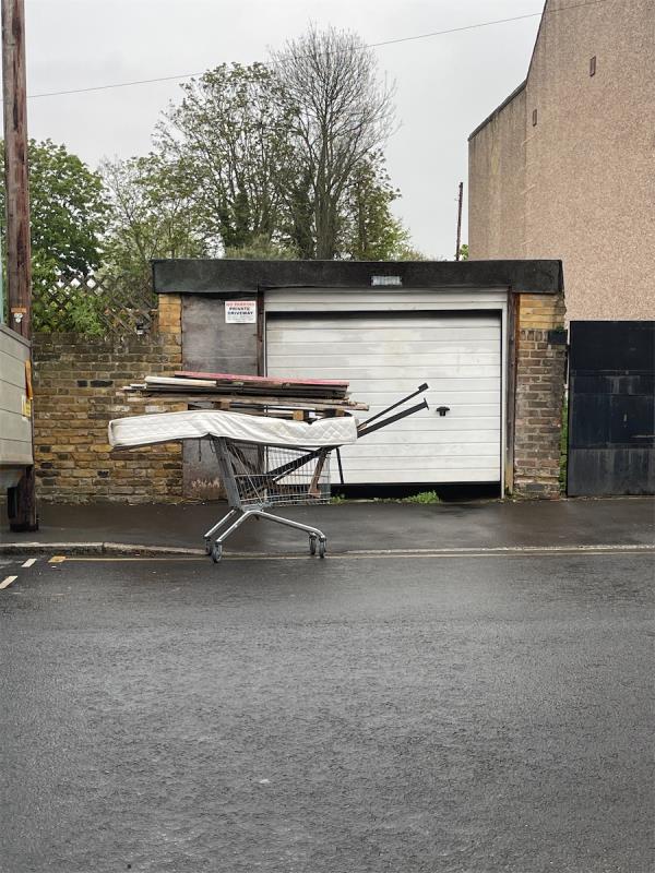 Trolley with matress and wood left on street -1 Park Road, Stratford, London, E15 3QP