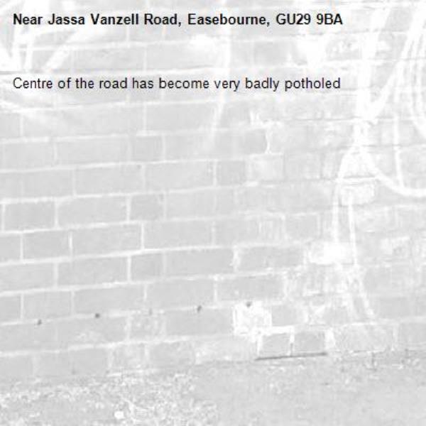 Centre of the road has become very badly potholed-Jassa Vanzell Road, Easebourne, GU29 9BA