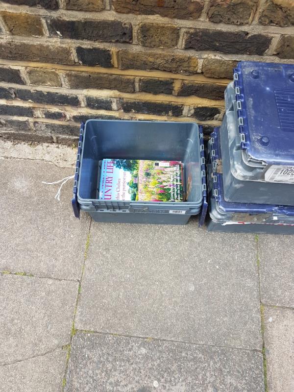 Three boxes containing magazines. Earlier today someone had kicked them over which then covered the pavement. Two boxes were kicked or thrown onto the road. I placed them on the pavement only to discover that someone had thrown them yet again onto the road between parked cars !-16 Jerningham Road, New Cross Gate, SE14 5NX