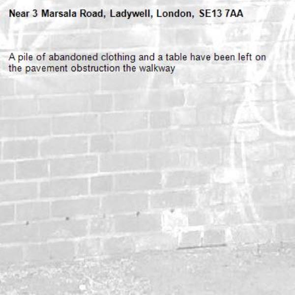 A pile of abandoned clothing and a table have been left on the pavement obstruction the walkway-3 Marsala Road, Ladywell, London, SE13 7AA