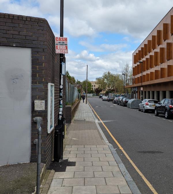 Correx sign on lamp post-New Cross Kiosk, New Cross Railway Station, Amersham Vale, London, SE14 6LD