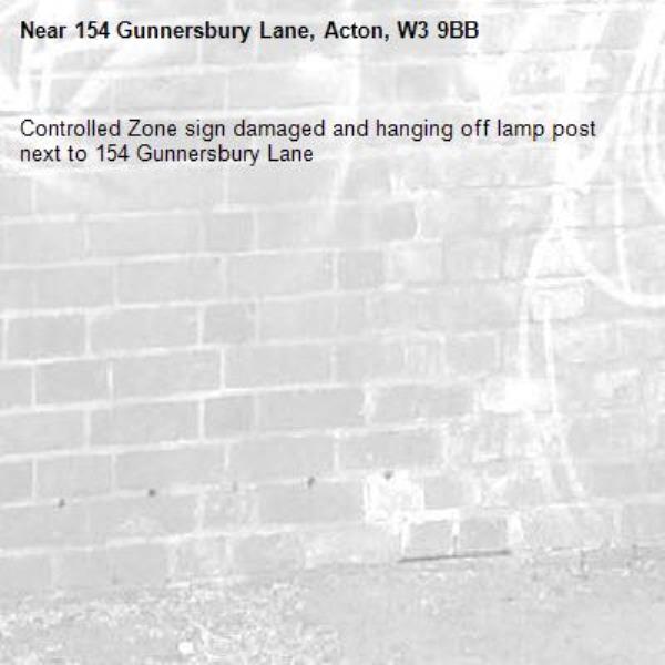 Controlled Zone sign damaged and hanging off lamp post next to 154 Gunnersbury Lane -154 Gunnersbury Lane, Acton, W3 9BB