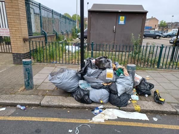 Bags of clothing and household waste fly tipped outside the Shaftesbury Car park, at 66 Shaftesbury Road, E7.-66 Shaftesbury Road, Forest Gate, London, E7 8PD