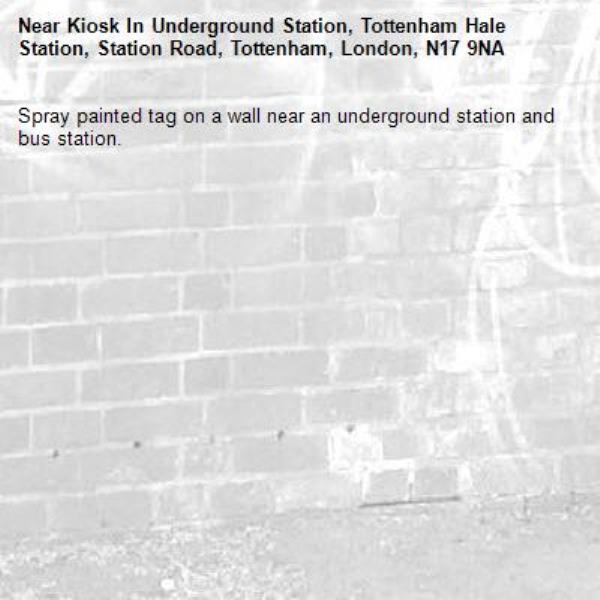 Spray painted tag on a wall near an underground station and bus station.-Kiosk In Underground Station, Tottenham Hale Station, Station Road, Tottenham, London, N17 9NA