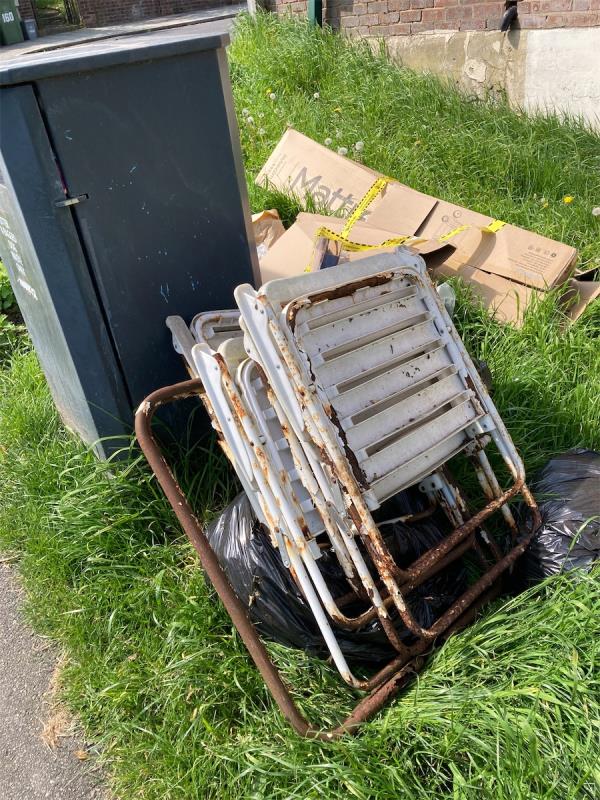 Fly tipping-left next to a park bin.-251 Manwood Road, London, SE4 1SF