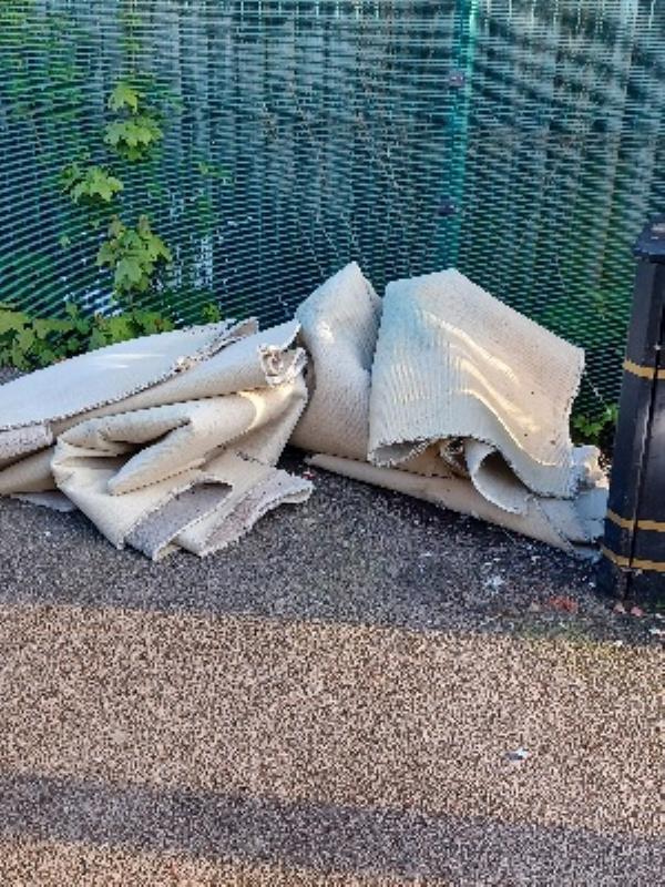 old carpet dumped on walkway to Cravens Victoria Road East end-286 Victoria Road East, Leicester, LE5 0LF